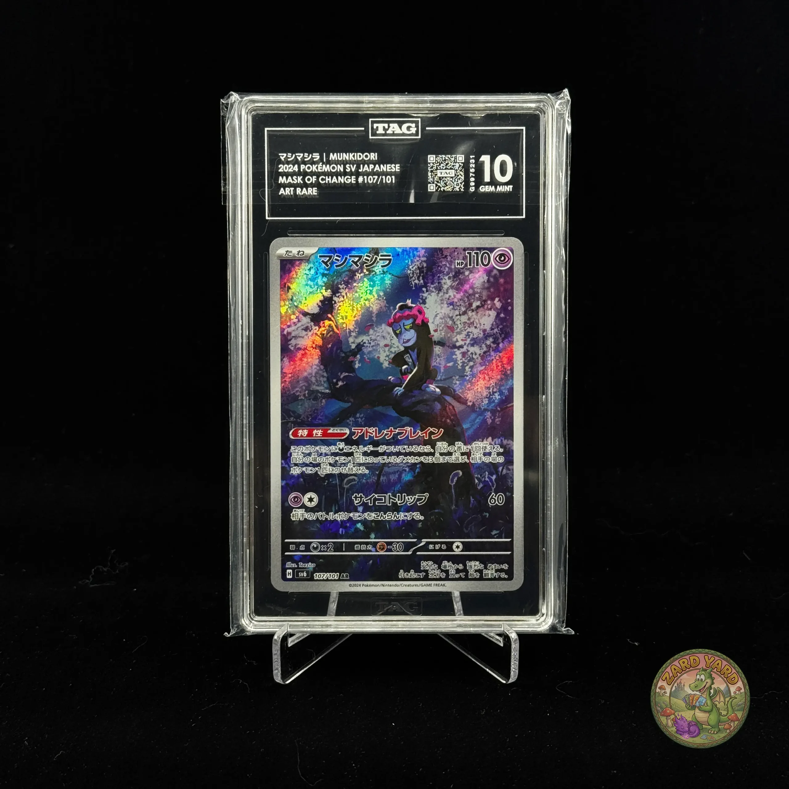 TAG 10 Munkidori graded Pokémon card slab front view photographed for collectors and Pokémon TCG buyers. TAG 10 Munkidori graded Pokémon card slab front view photographed for collectors and Pokémon TCG buyers.