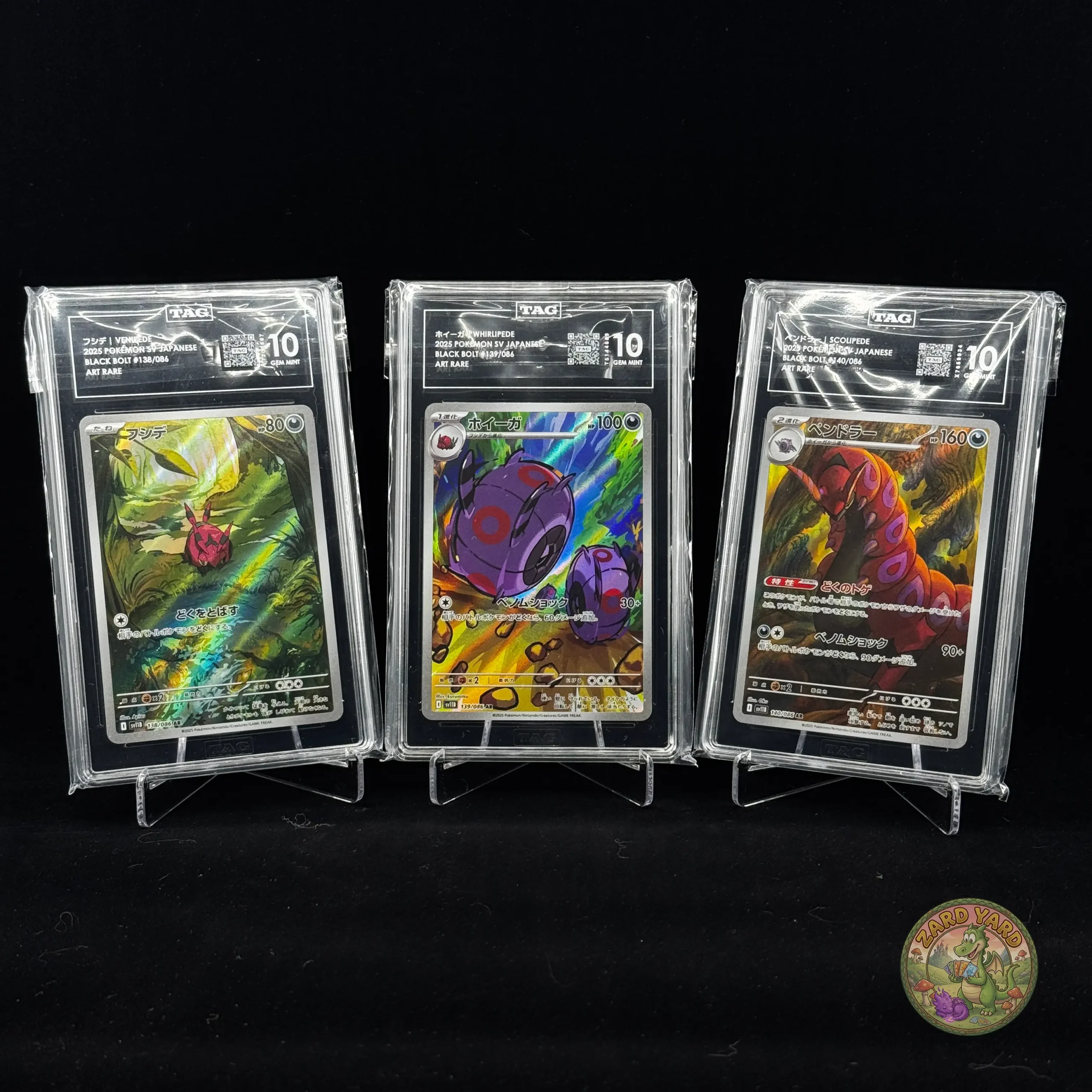 TAG 10 Venipede, Whirlipede & Scolipede graded Pokémon card slabs front view photographed for collectors and Pokémon TCG buyers. TAG 10 Venipede, Whirlipede & Scolipede graded Pokémon card slabs front view photographed for collectors and Pokémon TCG buyers.